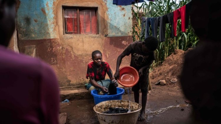 Villagers in Malawi fetch water from a well amid a deadly cholera outbreak compounded by polluted water sources