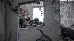 Rescuers search for survivors in a partially destroyed residential building, after a shelling in Sloviansk, on April 14, 2023