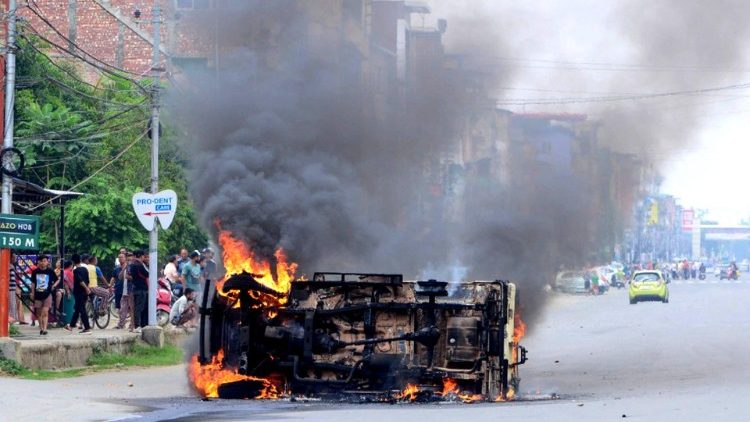 A vehicle burns during a violent protest in Manipur on May 4.