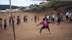 Children in the Democratic Republic of Congo playing soccer with makeshift equipment