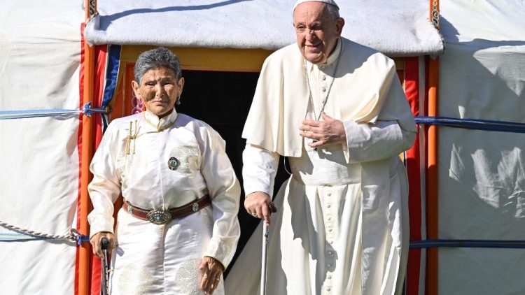 Pope Francis in Mongolia with Tsetsege, who had rescued a satuette of the Lady Mother of Heaver from a pile of rubbish