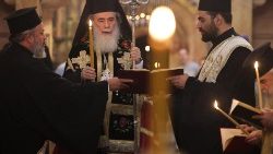 Greek Orthodox Patriarch Theophilos III leads a prayer for peace