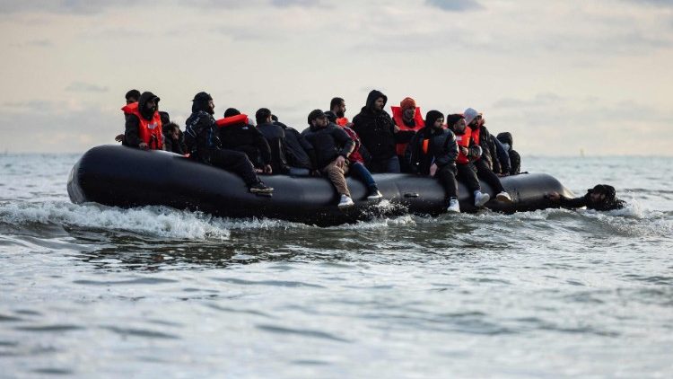Migrants board a smuggler's boat in the English channel