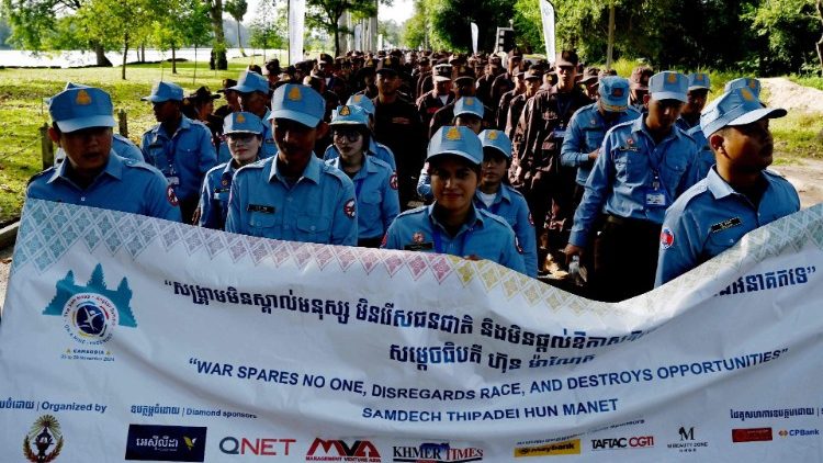 Deminers from the Cambodian Mine Action Centre (CMAC) march for the banning of landmines, November 24