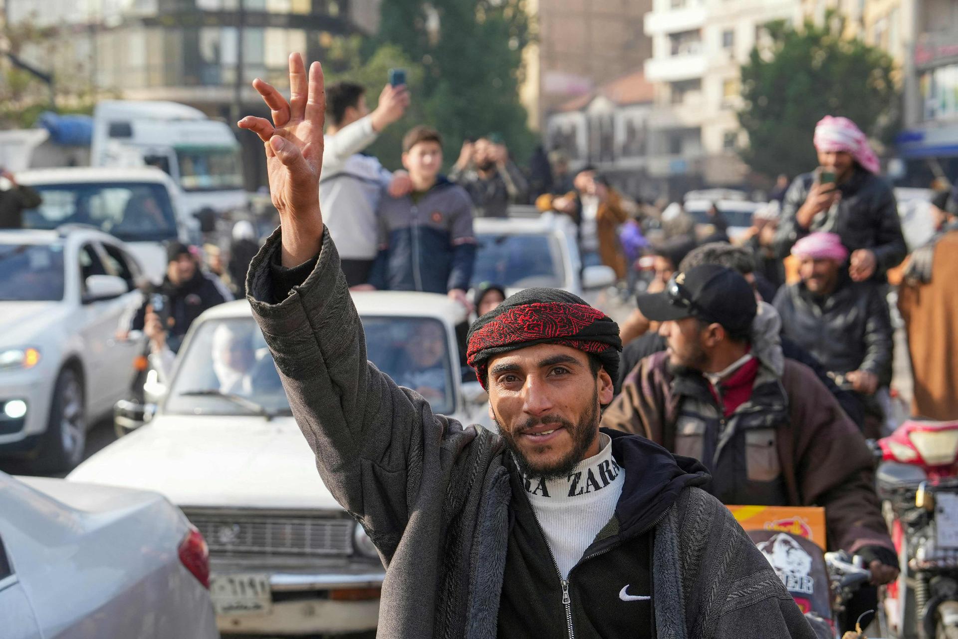 Syrians celebrate in the city of Homs
