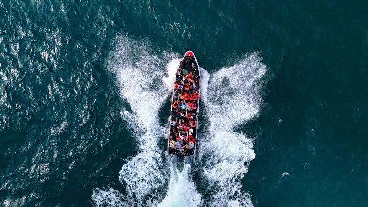 Migrants bound to Colombia travel by boat from Miramar, Panama