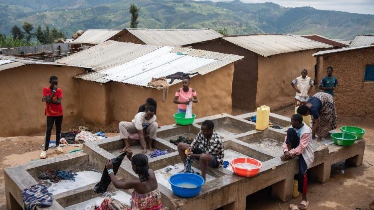 Women gather to wash clothes at a communal washing point in the Kiziba Refugee Camp in Karongi