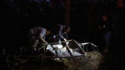 Members of the Center for Investigation and Prevention of Aeronautical Accidents (CENIPA) examine the wreckage of a hot air balloon in Praia Grande, Santa Catarina State, southern Brazil.