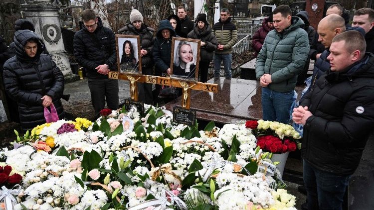 Mourners at the graves of those killed in a Russian missile attack on Ternopil on November 19