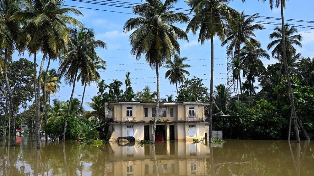 A residential house inundated by floodwaters in Wellampitiya on the outskirts of Colombo on December 1, 2025. Tropical storms and monsoon rains have pummelled Southeast and South Asia this month, triggering landslides and flash floods from the rainforests of Indonesia's western Sumatra island to highland plantations in Sri Lanka. (Photo by Ishara S. KODIKARA / AFP)