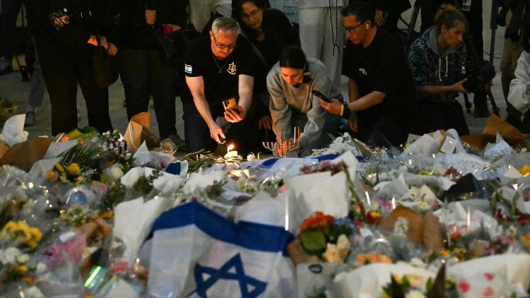 Mourners gather at a tribute at the Bondi Pavillion in memory of the victims of the shooting, which killed 16 people