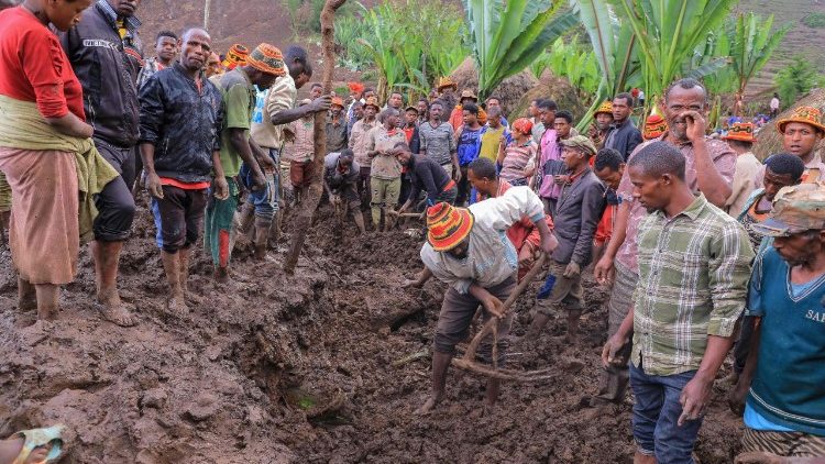Residents dig at the scene of a landslide in Mazo Doysa in Ethiopia's Gamo Zone on March 13, 2026