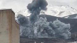 Smoke from an attack rises from the side of a mountain in Hamedan, western Iran