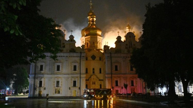Smoke and fire rises from the Dormition Cathedral in the Orthodox complex of the Kyiv Pechersk Lavra following a Russian missile strike on the Ukrainian capital Kyiv on June 15, 2026, amid the Russian invasion in Ukraine. A major missile attack struck Kyiv early on June 15, an AFP reporter witnessed, with projectiles intercepted in the sky and glowing debris falling onto the city. Ukrainian officials including the city's mayor Vitali Klitschko reported on Telegram that strikes hit various districts. (Photo by Genya Savilov / AFP)