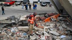 Rescue workers search for victims in Carabelleda, La Guaira State