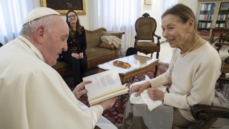 Mrs Bruck provides the Pope with a copy of one of her books