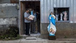 A man sells images of the Blessed Virgin Mary in Managua