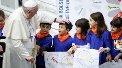 File photo of Pope Francis and a group of children during the weekly General Audience