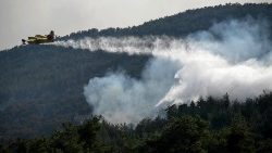 A firefighting aircraft operates during a wildfire at Dadia forest, Thrace, northern Greece