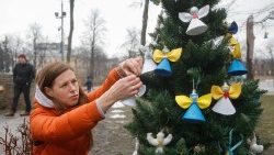 Ukrainians in Kyiv decorate a Christmas tree with angels and hearts symbolizing those killed in the Maidan uprising (2013-14) and in the ongoing war with Russia
