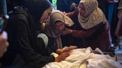 Relatives mourn the killing of children in an Israeli airstrike on Khan Yunis