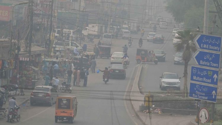 People drive amid heavy smog in Lahore on November 7, 2024