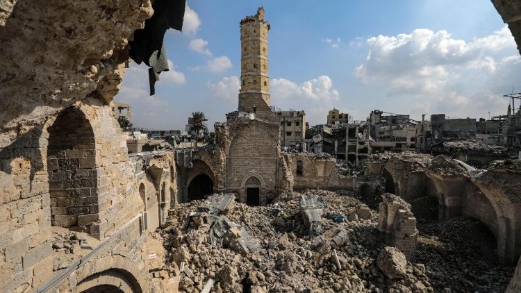 Palestinians gather at destroyed Great Omari Mosque in Gaza