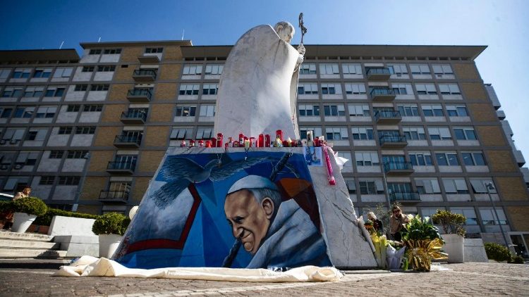 People pray for the Pope's health outside the Gemelli hospital