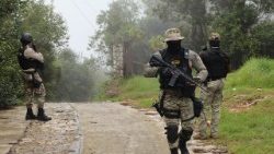 Members of the Haitian National Police patrol the streets in Kenscoff