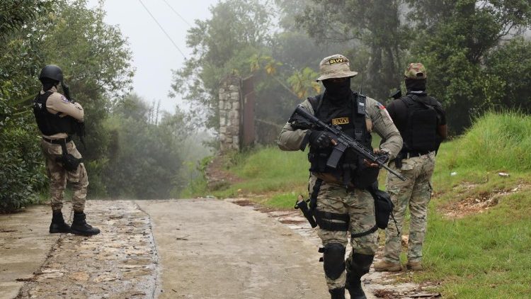 Members of the Haitian National Police patrol the streets in Kenscoff