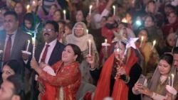 Pakistani Christians light candles as they gather during Christmas celebrations in Lahore