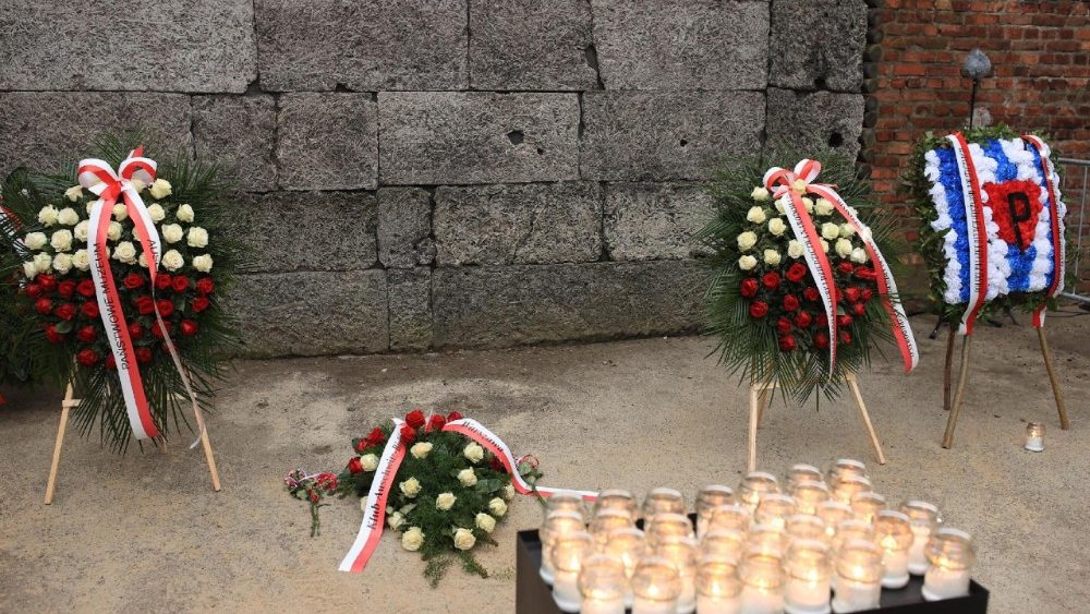 A wreath-laying ceremony with the participation of former camp prisoners in front of the Death Wall at the former Auschwitz camp in Oswiecim, Poland