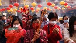 Taoist worshippers celebrate the Lunar New Year at Wong Tai Sin Temple in Hong Kong in 2021 