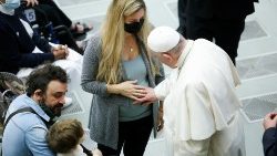 FIle photo of Pope Francis blessing pregnant woman's unborn child