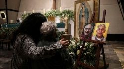 Relatives and friends of the two murdered Jesuits attend a Mass