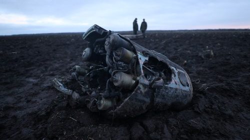 Investigators gather near fragments of a munition in the Grodno region, Belarus