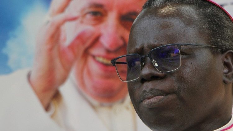 The Archbishop of Juba, Stephen Ameyu with a portrait of Pope Francis in the background.