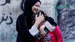 Palestinian women attend the funeral of a relative