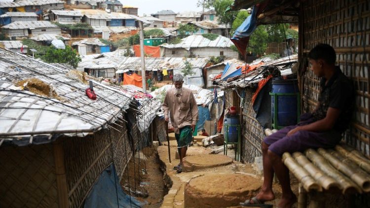FILE PHOTO: A Rohingya refugee walks at a refugee camp in Cox's Bazar