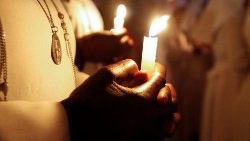 Worshippers attend Easter vigil mass at the St. Joanes, Legio Maria of African Church Mission within Fort Jesus in Kibera district of Nairobi