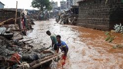 Residents recover their belongings after the Nairobi river burst its banks in the Mathare Valley settlement in Nairobi