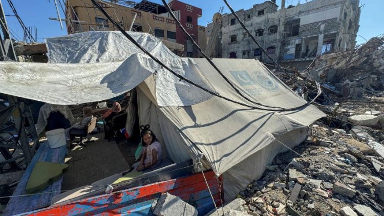 A displaced Palestinian girl in a tent in Rafah