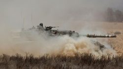 An Israeli tank maneuvers, amid the ongoing conflict in Gaza between Israel and the Palestinian Islamist group Hamas, near the Israel-Gaza border, in southern Israel