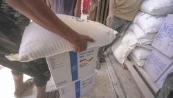 Food aid is distributed in Deir Al Balah, Gaza as part of a World Food Programme operation