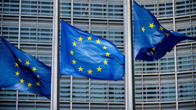 FILE PHOTO: European Union flags fly outside the European Commission headquarters in Brussels