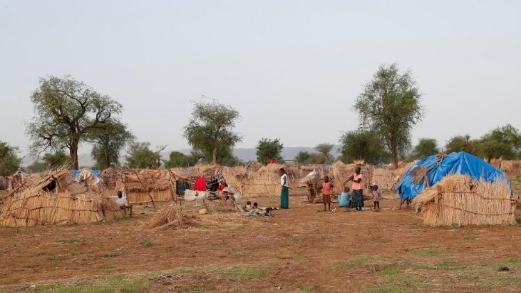 Internally displaced people from Khartoum gather at their shelter in South Kordofan, Sudan