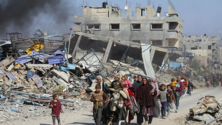 Displaced Palestinians flee the northern part of Gaza amid an Israeli military operation, in Gaza City