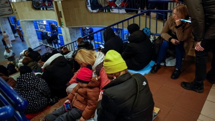 People take shelter inside a metro station during a Russian military attack in Kyiv