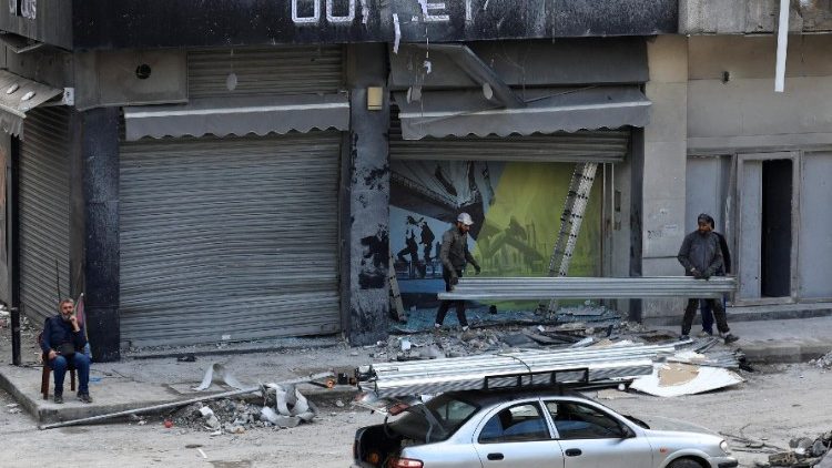 Men renovate their damaged shops, after the ceasefire between Israel and Hezbollah, in Beirut