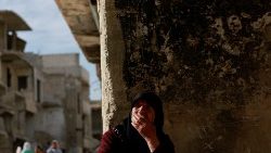 A woman reacts at the al-Yarmouk Palestinian refugee camp in Damascus, Syria